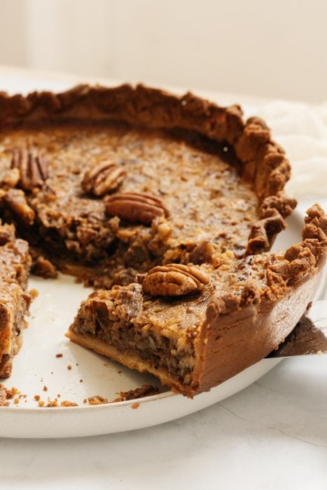 keto pecan pie being sliced on a plate