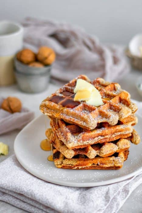 https://www.ketoconnect.net/wp-content/uploads/2021/01/keto-waffles-stacked-on-a-plate-with-butter-467x700.jpg