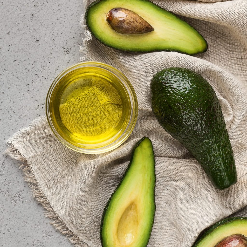 https://www.ketoconnect.net/wp-content/uploads/2022/07/halves-and-whole-avocadoes-and-bowl-of-oil-1024x1024.jpg